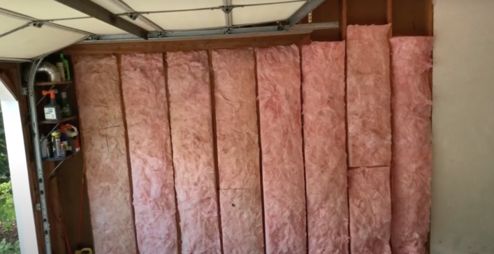 Pink fibreglass batts installed in garage wall panels